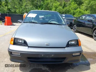 1994 Geo Metro z VIN 2C1MR2467R6760543, wystawiony jako IAAI lot #42439216 z przebiegiem 295 801 mil mil oraz . Historia ofert i sprzedaży dostępna na DreamBid. Obrazek 6.