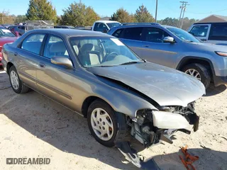 1999 Mazda 626 LX with VIN 1YVGF22D8X5871485, listed as a IAAI auction lot 41641049 with 115,603 mi miles. Bid and sale history available at carsss.com. Image 1.