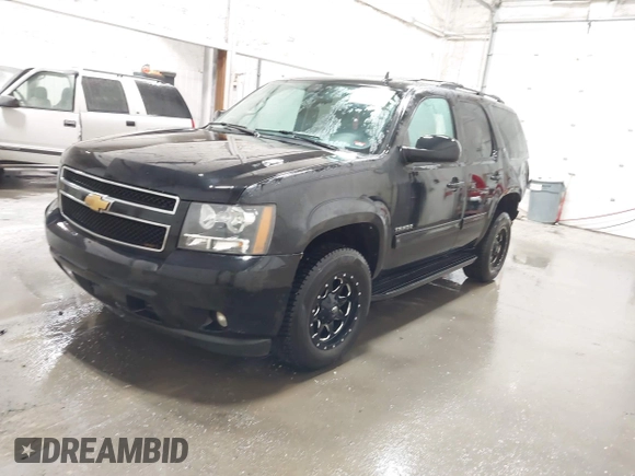 2013 Chevrolet Tahoe LT with VIN 1GNSKBE07DR305706, listed as a IAAI auction lot 42004594 with 166,020 mi miles and . Bid and sale history available at DreamBid. Image 2.