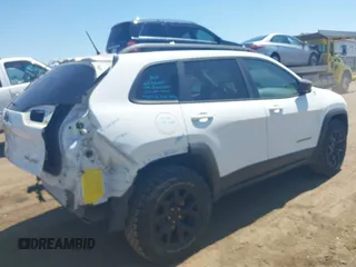 2014 Jeep Cherokee Trailhawk with VIN 1C4PJMBSXEW236807, listed as a IAAI auction lot 42660980 with 157,225 mi miles and . Bid and sale history available at DreamBid. Image 4.