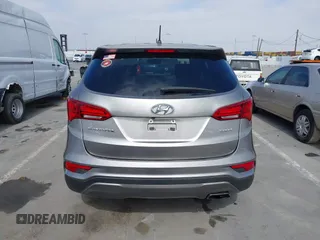 2018 Hyundai Santa Fe 2.4L with VIN 5NMZT3LB4JH069868, listed as a IAAI auction lot 42675555 with 142,612 mi miles and . Bid and sale history available at DreamBid. Image 16.