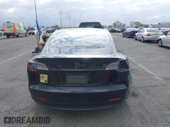 2019 Tesla Model 3 Mid Range with VIN 5YJ3E1EA3KF415601, listed as a IAAI auction lot 42125393 with 150,220 mi miles and . Bid and sale history available at carsss.com. Image 17.