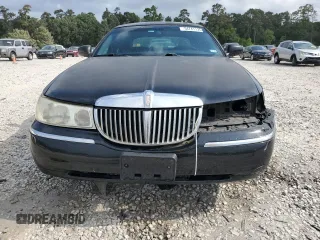 2001 Lincoln Town Car Executive z VIN 1LNHM81W11Y647756, wystawiony jako Copart lot #54741135 z przebiegiem 191 580 mil mil oraz Szkoda całkowita • Salvage title. Historia ofert i sprzedaży dostępna na DreamBid. Obrazek 5.