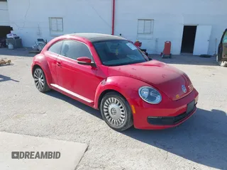 2014 Volkswagen Beetle 2.5L with VIN 3VWJX7AT7EM607340, listed as a IAAI auction lot 41747107 with 96,930 mi miles and . Bid and sale history available at DreamBid. Image 1.