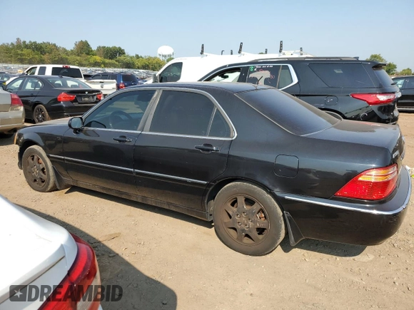 2002 Acura RL with VIN JH4KA96512C013028, listed as a Copart auction lot 71436914 with 142,527 mi miles and Salvage Title. Bid and sale history available at carsss.com. Image 2.