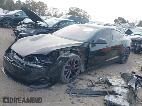 2022 Tesla Model S Plaid with VIN 5YJSA1E6XNF460235, listed as a IAAI auction lot 40951359 with 18,922 mi miles and . Bid and sale history available at DreamBid. Image 2.