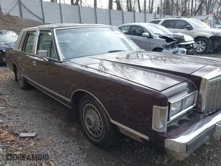 1987 Lincoln Town Car with VIN 1LNBM81F5HY704217, listed as a IAAI auction lot 41855678 with 86,794 mi miles. Bid and sale history available at carsss.com. Image 16.