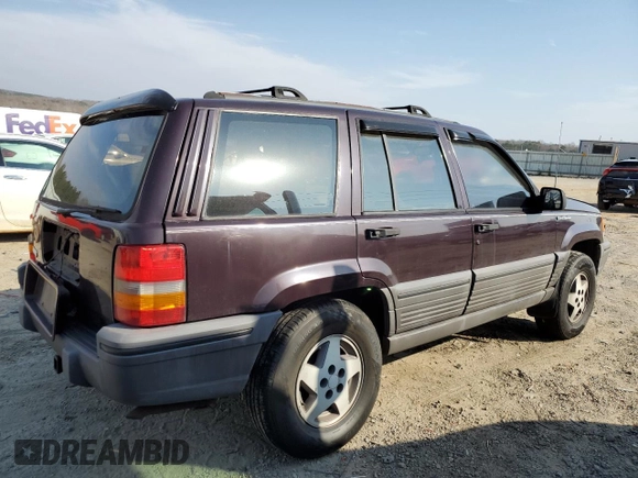 1993 Jeep Grand Cherokee Laredo with VIN 1J4GZ58S8PC656490, listed as a Copart auction lot 49377485 with 236,215 mi miles and Salvage Title. Bid and sale history available at carsss.com. Image 3.