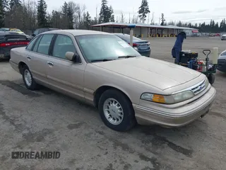 1997 Ford Crown Victoria LX z VIN 2FALP74W6VX226512, wystawiony jako IAAI lot #41771189 z przebiegiem 261 330 mil mil oraz . Historia ofert i sprzedaży dostępna na DreamBid. Obrazek 1.