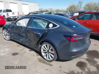 2018 Tesla Model 3 Long Range Battery with VIN 5YJ3E1EBXJF055203, listed as a IAAI auction lot 42019770 with 57,379 mi miles and . Bid and sale history available at DreamBid. Image 3.
