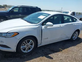 2018 Ford Fusion SE z VIN 3FA6P0LU2JR261268, wystawiony jako IAAI lot #42301578 z przebiegiem 63 357 mil mil oraz . Historia ofert i sprzedaży dostępna na DreamBid. Obrazek 6.