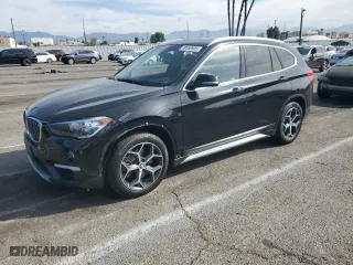 2019 BMW X1 xDrive28i with VIN WBXHT3C52K5N23533, listed as a Copart auction lot 50658905 with 31,211 mi miles and Salvage Title. Bid and sale history available at carsss.com. Image 1.