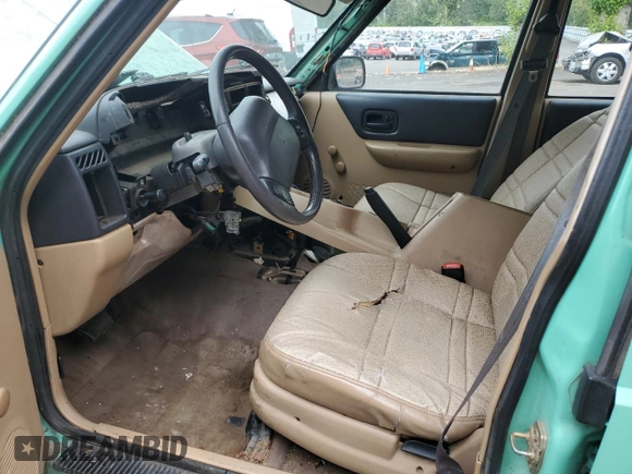 1999 Jeep Cherokee SE with VIN 1J4FF28SXXL641556, listed as a Copart auction lot 62605065 with Not provided miles and Salvage title. Bid and sale history available at DreamBid. Image 7.