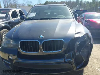 2011 BMW X5 35i with VIN 5UXZV4C51BL740731, listed as a IAAI auction lot 41771257 with 148,638 mi miles. Bid and sale history available at carsss.com. Image 12.