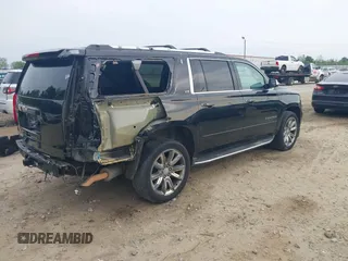 2015 Chevrolet Suburban LTZ with VIN 1GNSCKKCXFR731873, listed as a IAAI auction lot 42069917 with 108,963 mi miles and . Bid and sale history available at DreamBid. Image 4.