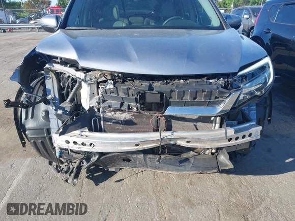 2020 Honda Pilot EX-L z VIN 5FNYF5H51LB016163, wystawiony jako IAAI lot #42030430 z przebiegiem 65 383 mil mil oraz . Historia ofert i sprzedaży dostępna na DreamBid. Obrazek 6.