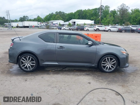 2015 Scion tC z VIN JTKJF5C75F3089895, wystawiony jako IAAI lot #42226465 z przebiegiem 106 694 mil mil oraz . Historia ofert i sprzedaży dostępna na DreamBid. Obrazek 13.