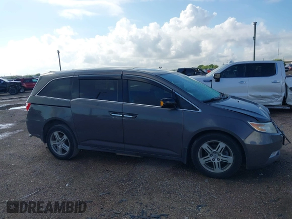 2011 Honda Odyssey Touring with VIN 5FNRL5H93BB104436, listed as a IAAI auction lot 40426003 with 93,342 mi miles and . Bid and sale history available at DreamBid. Image 13.