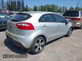 2014 Kia Rio SX with VIN KNADN5A31E6353714, listed as a IAAI auction lot 42127657 with 117,544 mi miles. Bid and sale history available at carsss.com. Image 4.