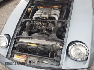 1983 Porsche 928 z VIN WP0ZZZ92ZDS841622, wystawiony jako Copart lot #76995304 z przebiegiem 83 862 mil mil oraz Szkody całkowita. Historia ofert i sprzedaży dostępna na DreamBid. Obrazek 11.