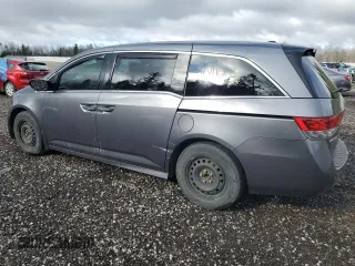 2014 Honda Odyssey Touring z VIN 5FNRL5H98EB512144, wystawiony jako Copart lot #69987533 z przebiegiem 184 231 mil mil oraz Szkoda całkowita • Salvage title. Historia ofert i sprzedaży dostępna na DreamBid. Obrazek 2.