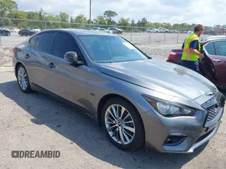 2018 Infiniti Q50 Luxe with VIN JN1EV7AP4JM590048, listed as a IAAI auction lot 41863410 with 55,727 mi miles and . Bid and sale history available at carsss.com. Image 1.