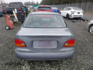 1997 Hyundai Accent z VIN KMHVF24N2VU365832, wystawiony jako IAAI lot #41549953 z przebiegiem 168 072 mil mil oraz . Historia ofert i sprzedaży dostępna na DreamBid. Obrazek 16.