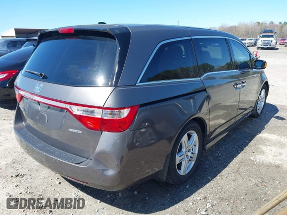 2012 Honda Odyssey Touring with VIN 5FNRL5H91CB057344, listed as a IAAI auction lot 41835272 with 158,854 mi miles. Bid and sale history available at carsss.com. Image 4.