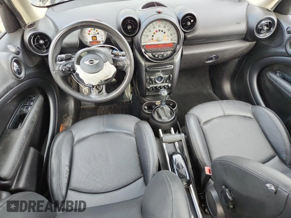 2014 MINI Countryman S with VIN WMWZC3C56EWP25479, listed as a Copart auction lot 61197525 with 101,146 mi miles and Salvage title. Bid and sale history available at DreamBid. Image 8.