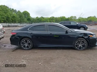 2019 Toyota Camry LE z VIN 4T1B11HK0KU739121, wystawiony jako IAAI lot #42372066 z przebiegiem 95 576 mil mil oraz . Historia ofert i sprzedaży dostępna na DreamBid. Obrazek 13.