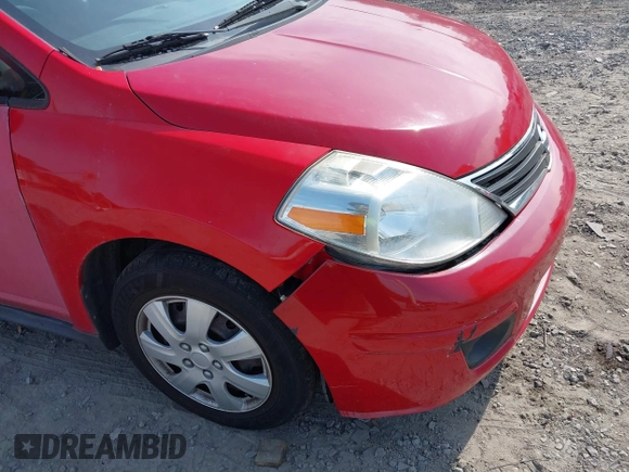 2012 Nissan Versa S with VIN 3N1BC1CP2CL374585, listed as a IAAI auction lot 42209609 with 196,501 mi miles. Bid and sale history available at carsss.com. Image 6.