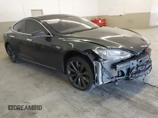 2014 Tesla Model S 60 with VIN 5YJSA1H13EFP49912, listed as a IAAI auction lot 41716661 with 129,776 mi miles and . Bid and sale history available at DreamBid. Image 1.