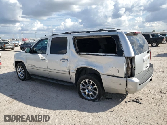 2011 Chevrolet Suburban LS with VIN 1GNSCHE08BR238949, listed as a Copart auction lot 74702004 with 147,451 mi miles and Salvage Title. Bid and sale history available at carsss.com. Image 2.