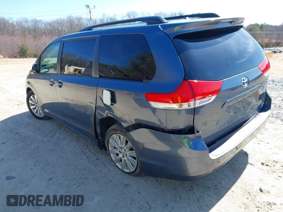 2014 Toyota Sienna LE with VIN 5TDJK3DC4ES087457, listed as a IAAI auction lot 41773128 with 103,993 mi miles and . Bid and sale history available at DreamBid. Image 3.