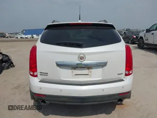 2013 Cadillac SRX Performance Collection z VIN 3GYFNDE30DS648288, wystawiony jako IAAI lot #41955462 z przebiegiem 135 956 mil mil oraz . Historia ofert i sprzedaży dostępna na DreamBid. Obrazek 16.