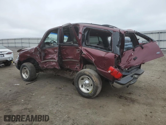 1999 Ford Expedition XLT with VIN 1FMPU18L6XLA61106, listed as a Copart auction lot 62688735 with 105,551 mi miles and Salvage title. Bid and sale history available at DreamBid. Image 2.