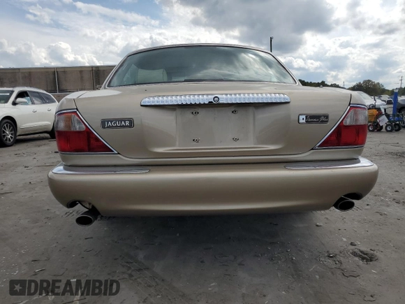 1999 Jaguar XJ z VIN SAJKX6048XC849376, wystawiony jako Copart lot #70538064 z przebiegiem 122 891 mil mil oraz Szkoda całkowita • Salvage title. Historia ofert i sprzedaży dostępna na DreamBid. Obrazek 6.