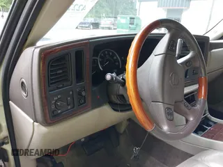 2003 Cadillac Escalade z VIN 1GYEK63NX3R241388, wystawiony jako IAAI lot #42227896 z przebiegiem 154 415 mil mil oraz . Historia ofert i sprzedaży dostępna na DreamBid. Obrazek 7.