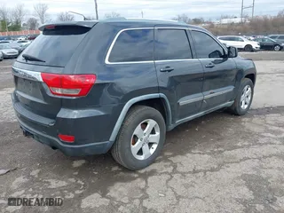 2011 Jeep Grand Cherokee Laredo with VIN 1J4RR4GG7BC721483, listed as a IAAI auction lot 41810180 with 181,558 mi miles. Bid and sale history available at carsss.com. Image 4.