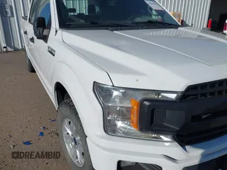 2018 Ford F-150 XL with VIN 1FTFW1E5XJFE79125, listed as a IAAI auction lot 42043296 with 165,003 mi miles. Bid and sale history available at carsss.com. Image 6.
