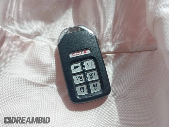 2022 Honda Odyssey EX-L with VIN 5FNRL6H70NB053843, listed as a IAAI auction lot 40210685 with 21,571 mi miles and . Bid and sale history available at DreamBid. Image 11.