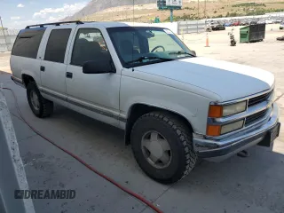 1999 Chevrolet Suburban with VIN 3GNFK16R4XG190883, listed as a Copart auction lot 58324415 with 228,782 mi miles and Salvage title. Bid and sale history available at DreamBid. Image 4.