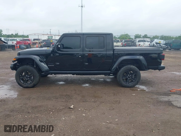 2023 Jeep Gladiator Overland with VIN 1C6JJTFM9PL593659, listed as a IAAI auction lot 42470253 with 34,374 mi miles and . Bid and sale history available at DreamBid. Image 14.