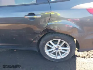 2015 Ford Focus SE with VIN 1FADP3F21FL317452, listed as a IAAI auction lot 41682921 with 999,999 mi miles. Bid and sale history available at carsss.com. Image 6.