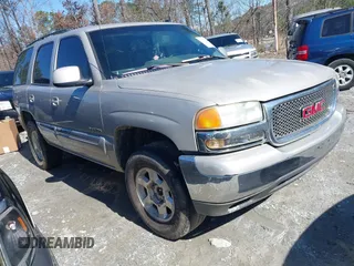 2005 GMC Yukon SLT with VIN 1GKEC13TX5J104235, listed as a IAAI auction lot 41574343 with 291,358 mi miles. Bid and sale history available at carsss.com. Image 1.