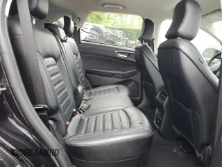2024 Ford Edge SEL z VIN 2FMPK4J99RBB00666, wystawiony jako Copart lot #58194325 z przebiegiem 28 661 mil mil oraz Czysty tytuł • Clean title. Historia ofert i sprzedaży dostępna na DreamBid. Obrazek 11.