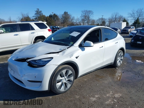 2022 Tesla Model Y Long Range with VIN 7SAYGDEE2NF440548, listed as a IAAI auction lot 41360276 with 19,714 mi miles and . Bid and sale history available at carsss.com. Image 19.