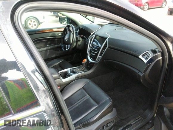 2016 Cadillac SRX Performance Collection z VIN 3GYFNCE32GS505552, wystawiony jako IAAI lot #40949642 z przebiegiem 143 343 mil mil oraz . Historia ofert i sprzedaży dostępna na DreamBid. Obrazek 5.