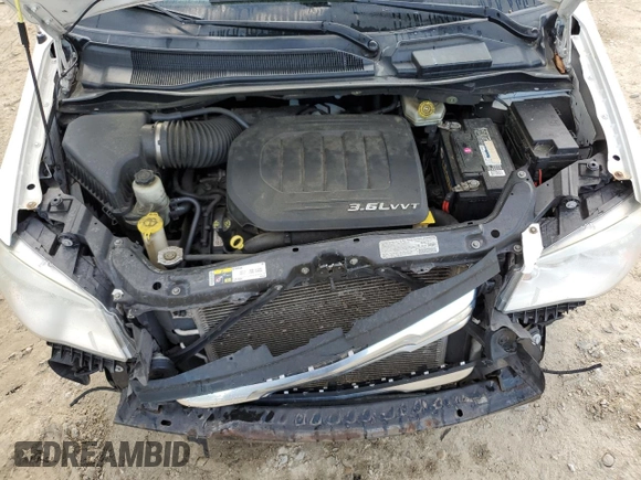 2013 Chrysler Town & Country Touring z VIN 2C4RC1BG3DR674413, wystawiony jako Copart lot #55902355 z przebiegiem 131 434 mil mil oraz Szkoda całkowita • Salvage title. Historia ofert i sprzedaży dostępna na DreamBid. Obrazek 12.