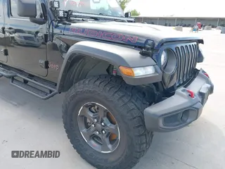 2021 Jeep Gladiator Rubicon z VIN 1C6JJTBG6ML535939, wystawiony jako IAAI lot #42260764 z przebiegiem 114 060 mil mil oraz . Historia ofert i sprzedaży dostępna na DreamBid. Obrazek 17.